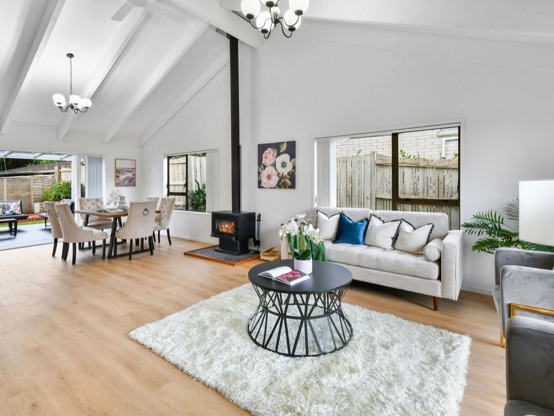 Open-plan living room by Living Colour, Auckland